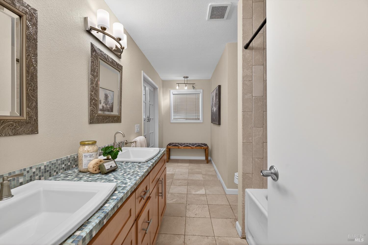 985 Hacienda Circle Rohnert Park, CA 94928 - Photo 23 of 36 a bathroom with a granite countertop sink and a mirror