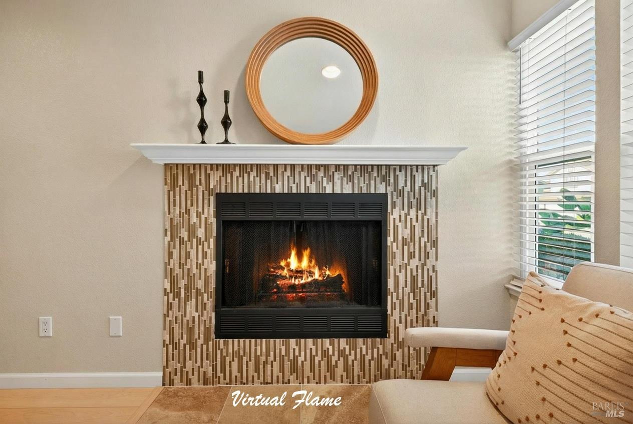 985 Hacienda Circle Rohnert Park, CA 94928 - Photo 6 of 36 a living room with furniture a fireplace and a large window