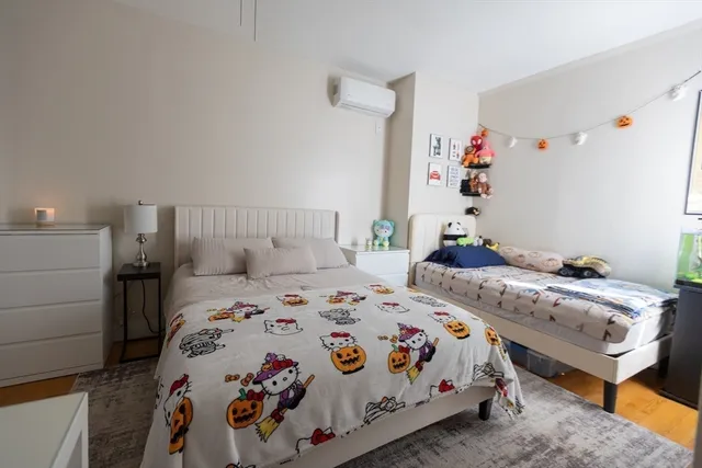 a bedroom that has a bed and a closet