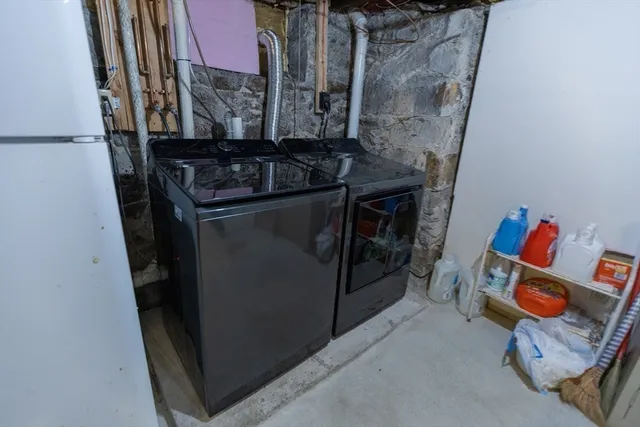 a view of a patio with couches under an umbrella