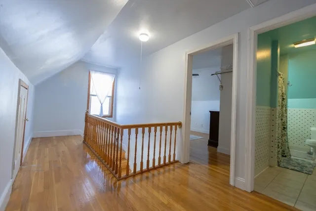 wooden floor in a hall with a window