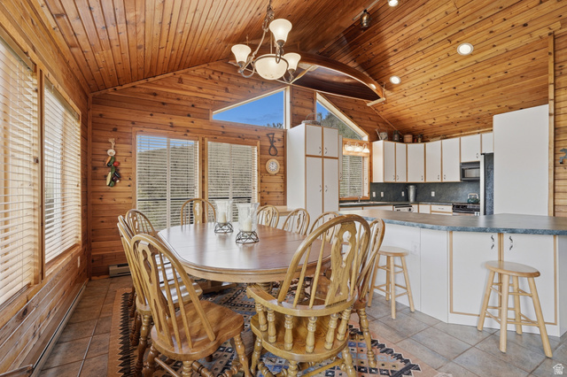 6 Beaver Springs Rancheros Oakley, UT 84055 - Photo 16 of 68 Vaulted wood-paneled ceilings over a dining area with multiple windows, recessed lighting, and a chandelier