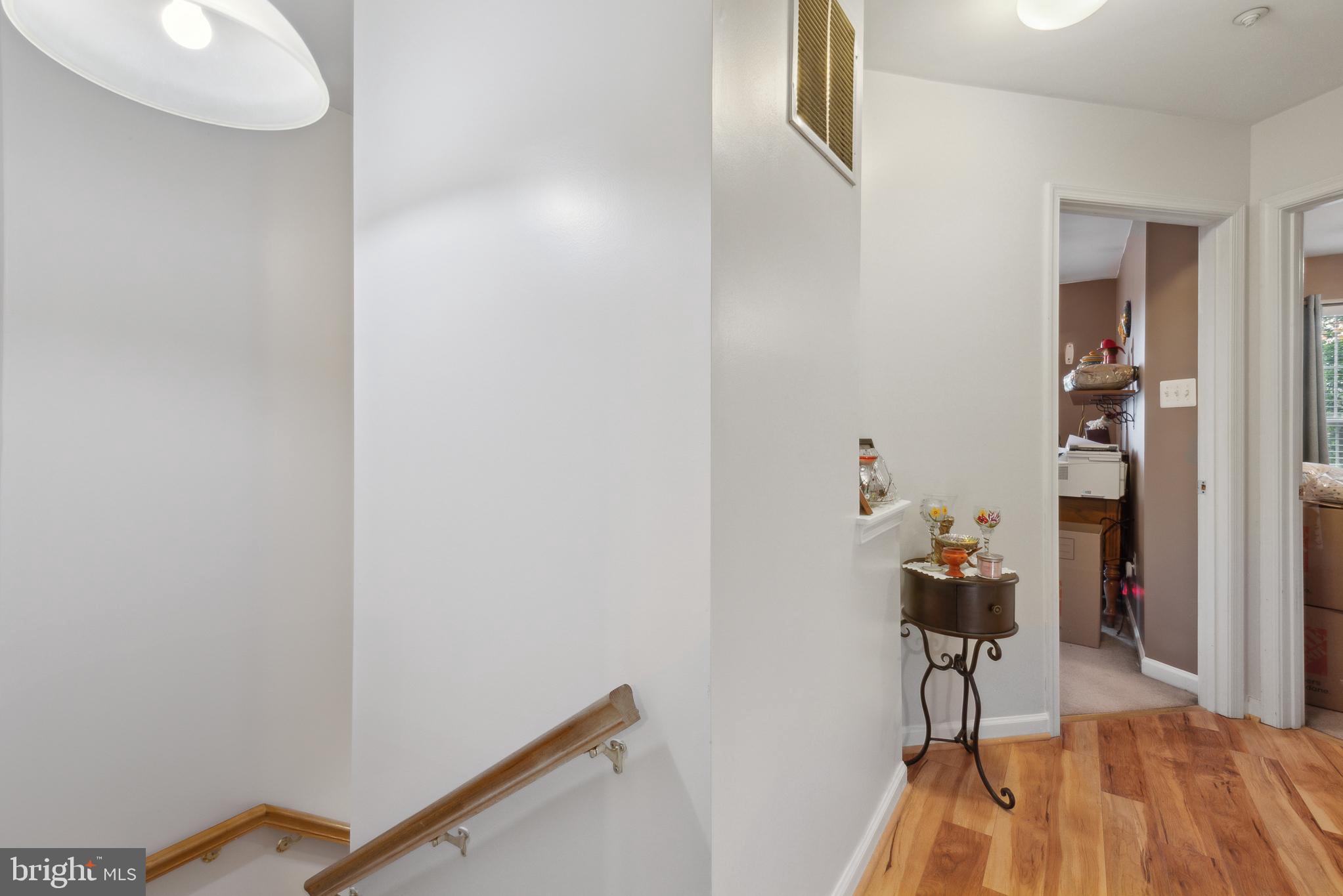 5533 Westcott Circle Frederick, MD 21703 - Photo 23 of 51 Stairs to uper level hallway