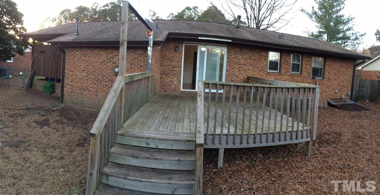 4224 Green Raleigh Nc 27604 Raleigh, NC 27604 - Photo 6 of 7 a view of a wooden house with a large window and wooden fence