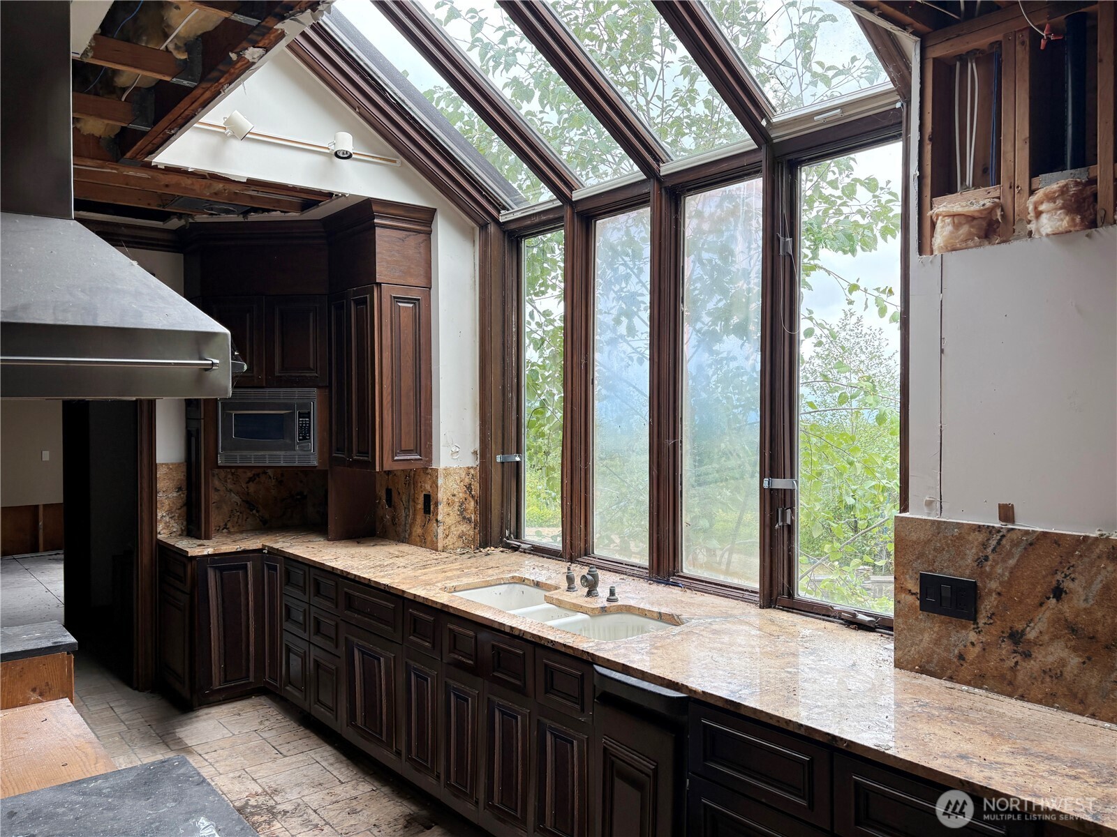 31433 Southeast 62nd Way Fall City, WA 98024 - Photo 23 of 40 a kitchen with large windows a sink and cabinets