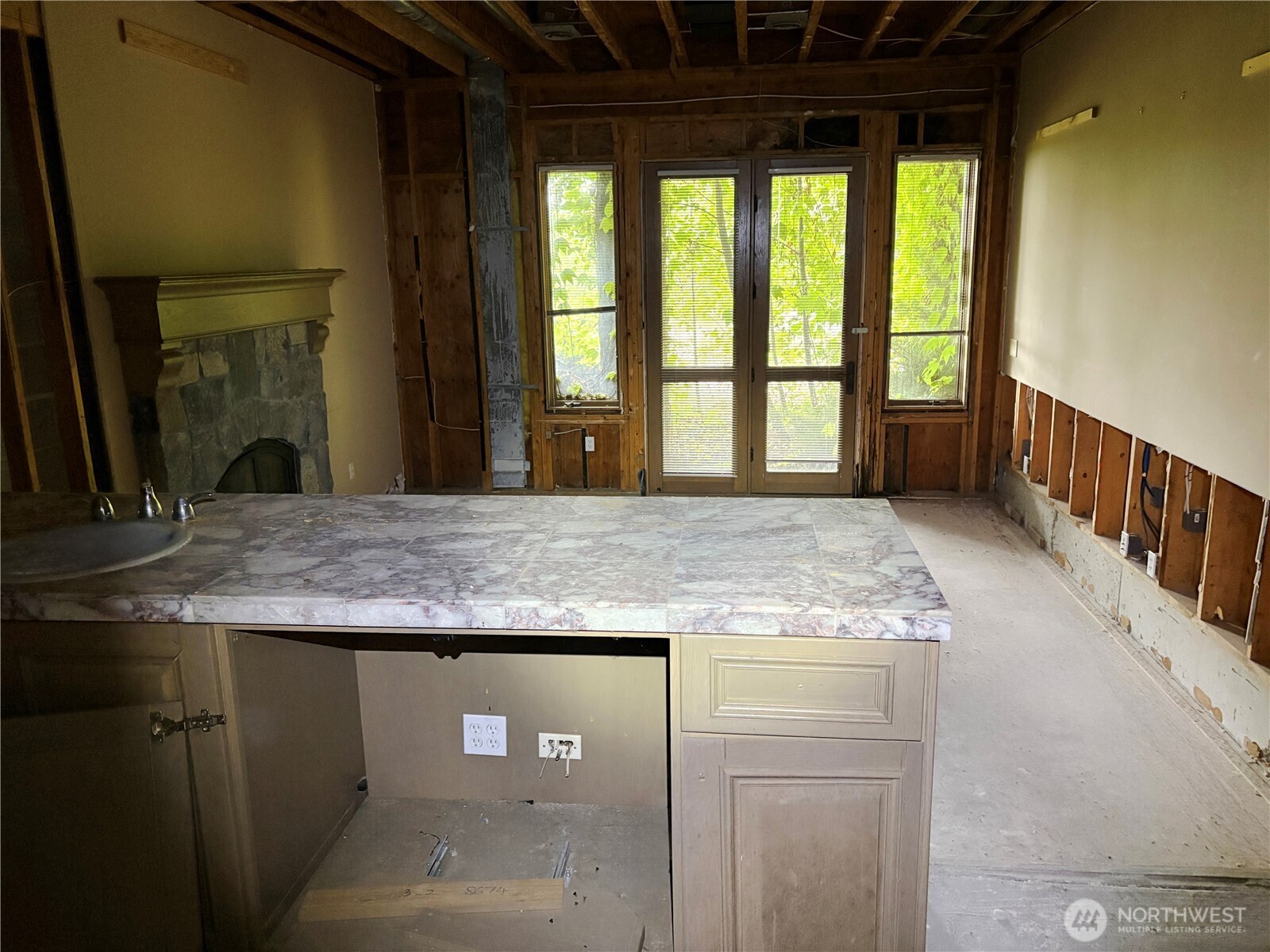 31433 Southeast 62nd Way Fall City, WA 98024 - Photo 36 of 40 a kitchen with a granite countertop sink and a large window