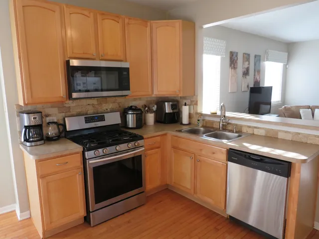 a kitchen with a stove and a sink