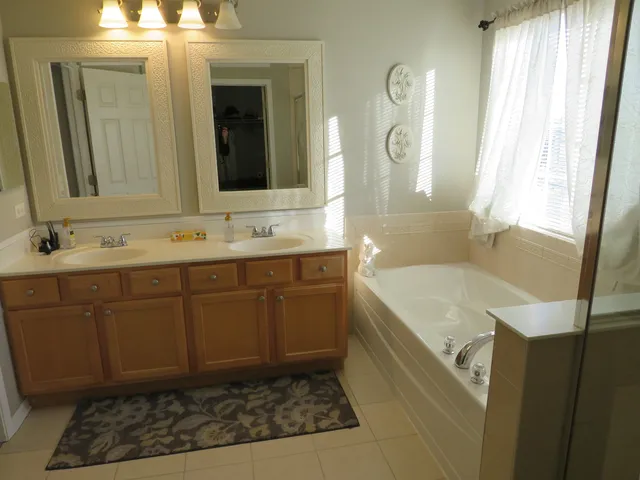a bathroom with a sink a vanity and a mirror