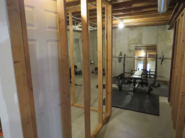 a bathroom with a glass shower door