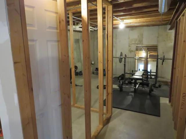 a bathroom with a glass shower door