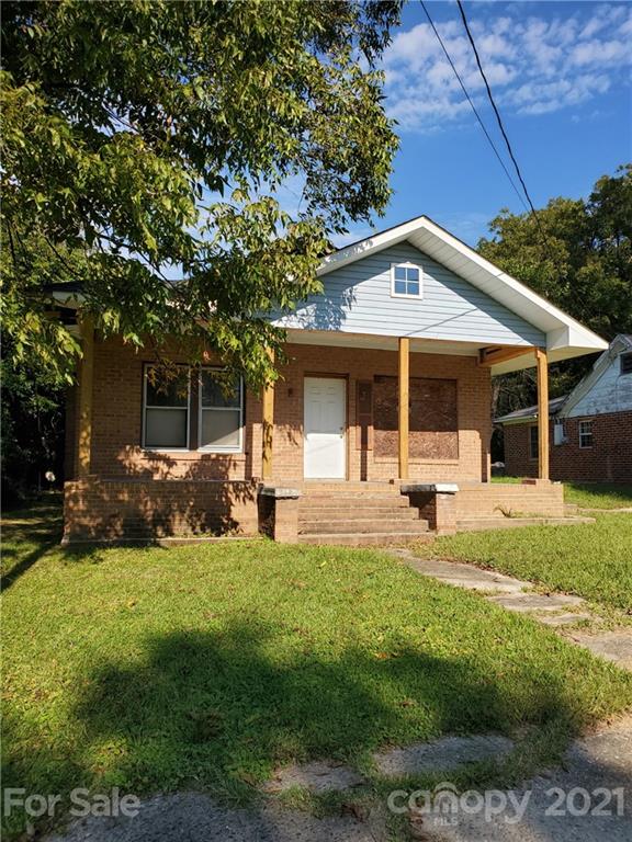 218 Robin Circle Salisbury, NC 28144 - Photo 1 of 8 a front view of a house with swimming pool and green space