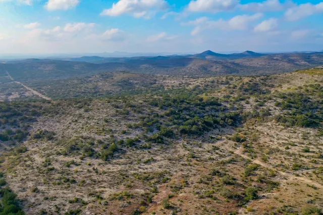 an aerial view of residential house and green space