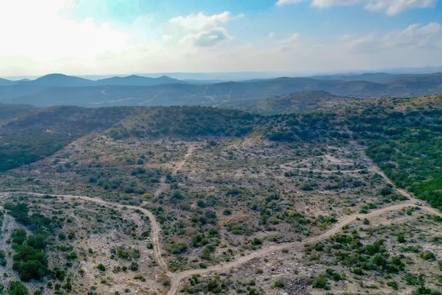 a view of mountains and valleys