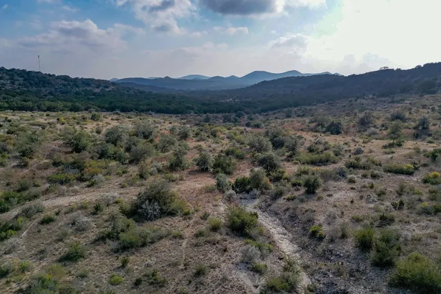 a view of a lake with mountains in the background