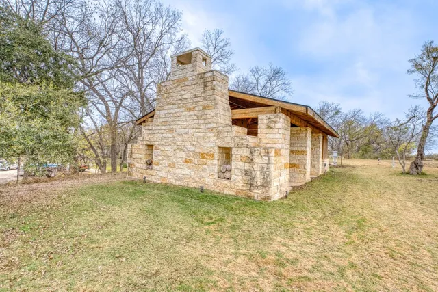 a view of a house with large windows