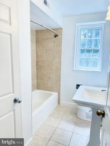a bathroom with a sink and a bathtub