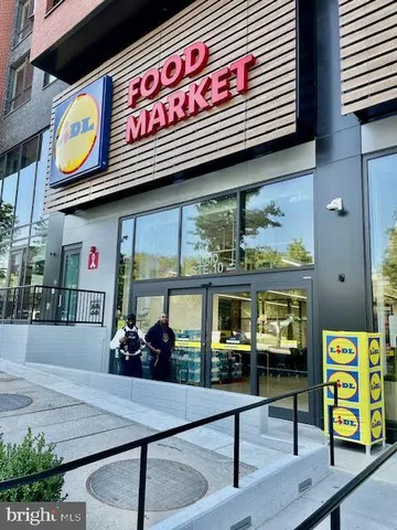 a view of a large building with a sign on the wall