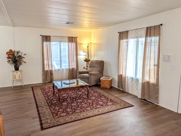 a living room with furniture and a rug
