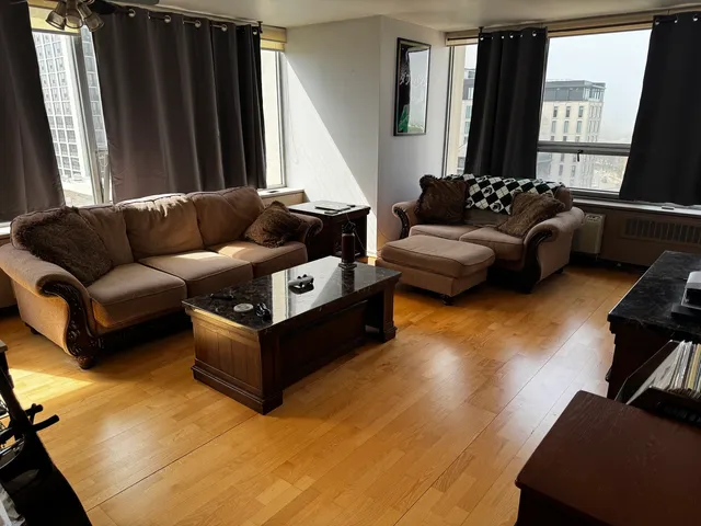 a living room with furniture and a large window