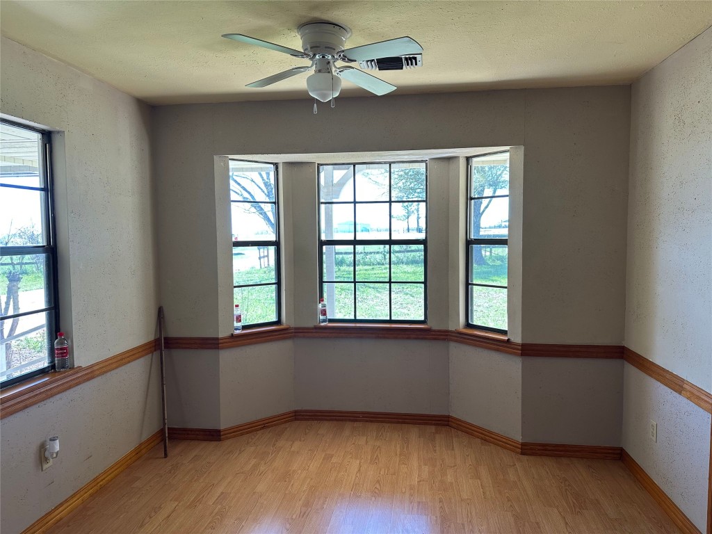 20136 Longstreet Road Richards, TX 77873 - Photo 29 of 50 wooden floor in an empty room with a window