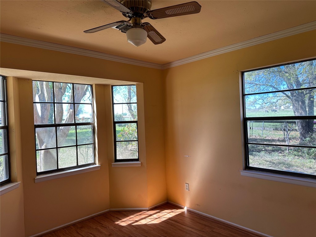 20136 Longstreet Road Richards, TX 77873 - Photo 37 of 50 a view of empty room with window and wooden floor