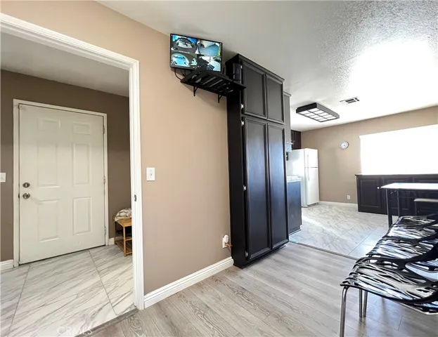 a view of a hallway view with wooden floor and staircase