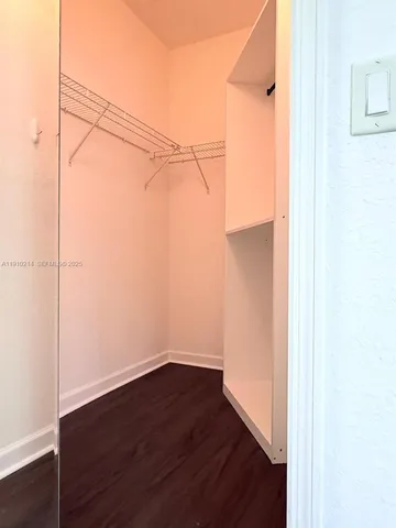 a view of a small space with wooden floor