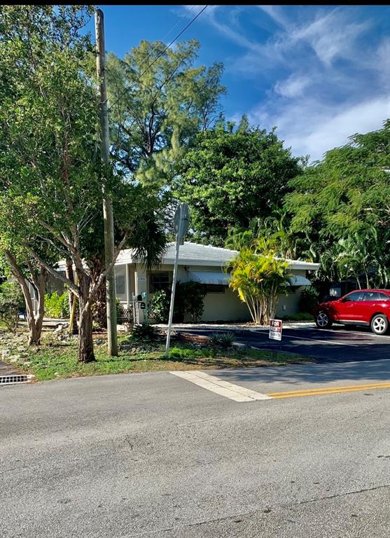 1301 Southeast 22nd Avenue, Unit 4 Pompano Beach, FL 33062 - Photo 13 of 14 a view of car parked in front of house