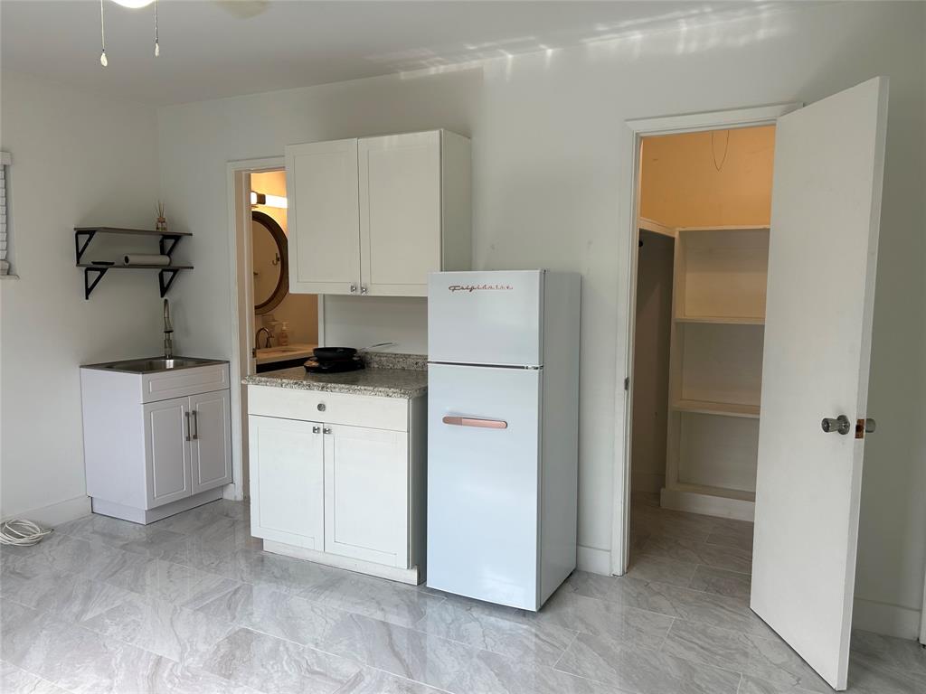 1301 Southeast 22nd Avenue, Unit 4 Pompano Beach, FL 33062 - Photo 2 of 14 a room with storage and utility