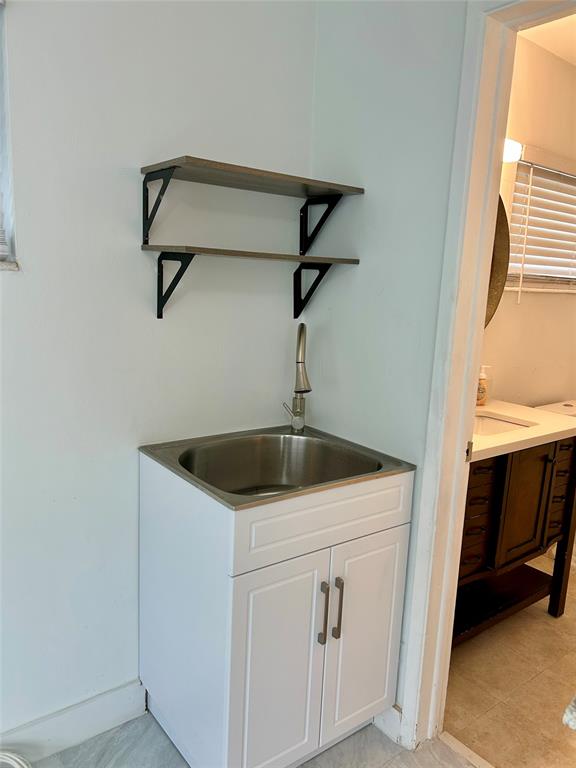 1301 Southeast 22nd Avenue, Unit 4 Pompano Beach, FL 33062 - Photo 7 of 14 a utility room with dryer and washer