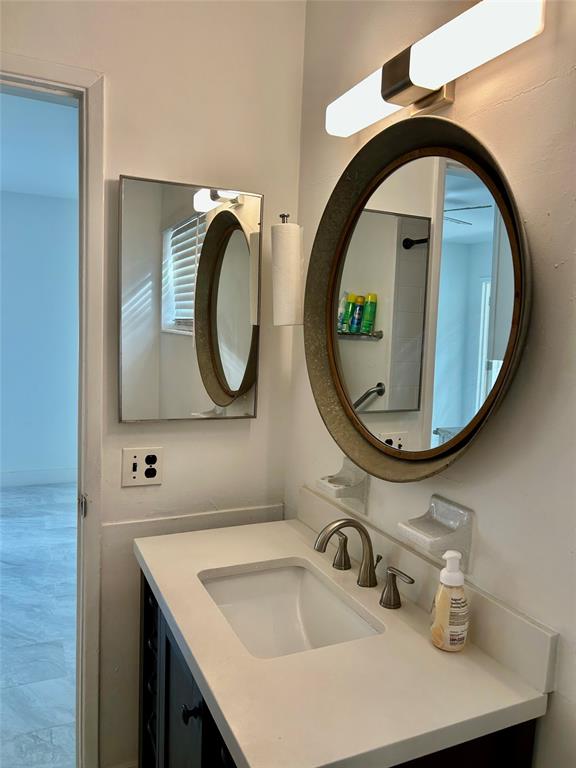 1301 Southeast 22nd Avenue, Unit 4 Pompano Beach, FL 33062 - Photo 9 of 14 a bathroom with a sink and a mirror