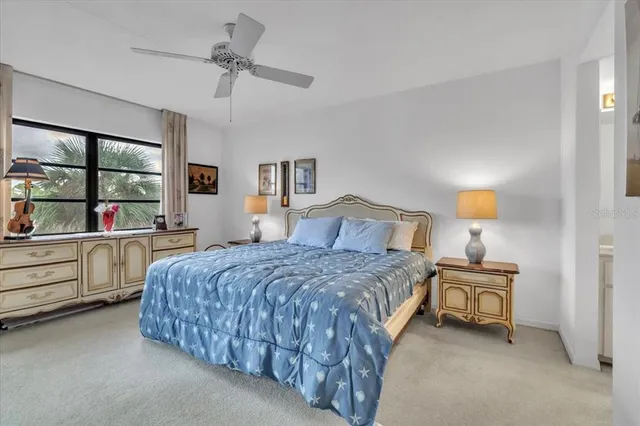 a bed room with a bed and a television