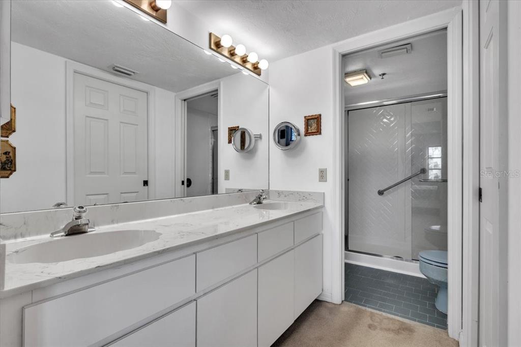 23465 Harbor View Road, Unit 723 Port Charlotte, FL 33980 - Photo 18 of 42 a bathroom with a sink and mirror