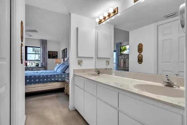 a living room with furniture a rug and a flat screen tv