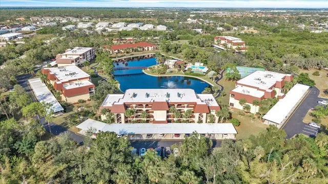 an aerial view of a house with a lake view