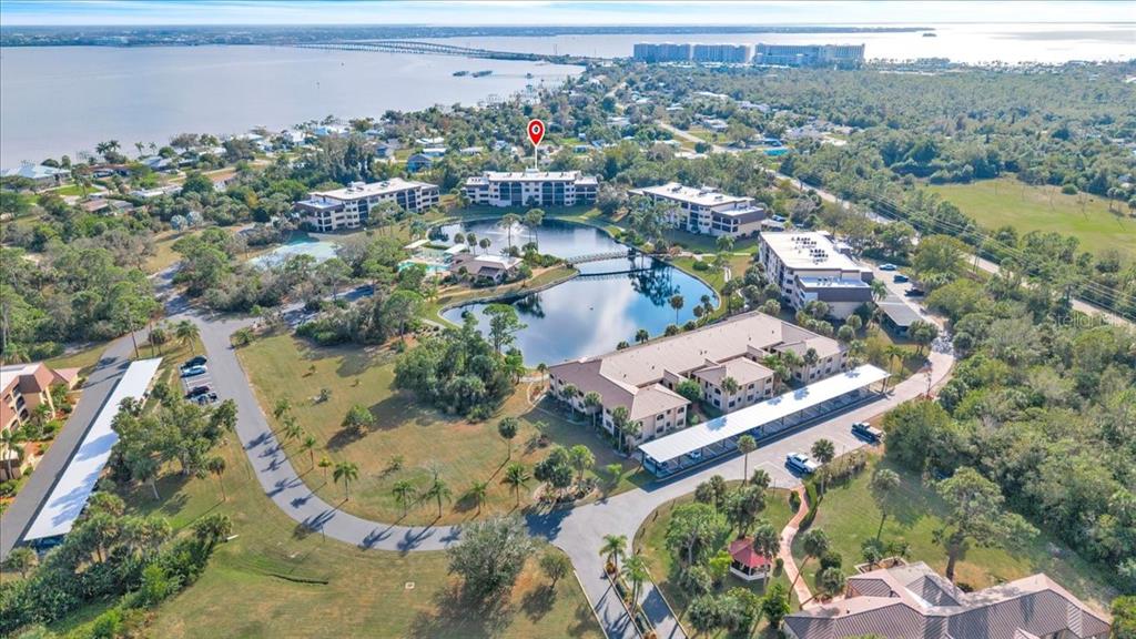 23465 Harbor View Road, Unit 723 Port Charlotte, FL 33980 - Photo 31 of 42 an aerial view of a residential houses with outdoor space