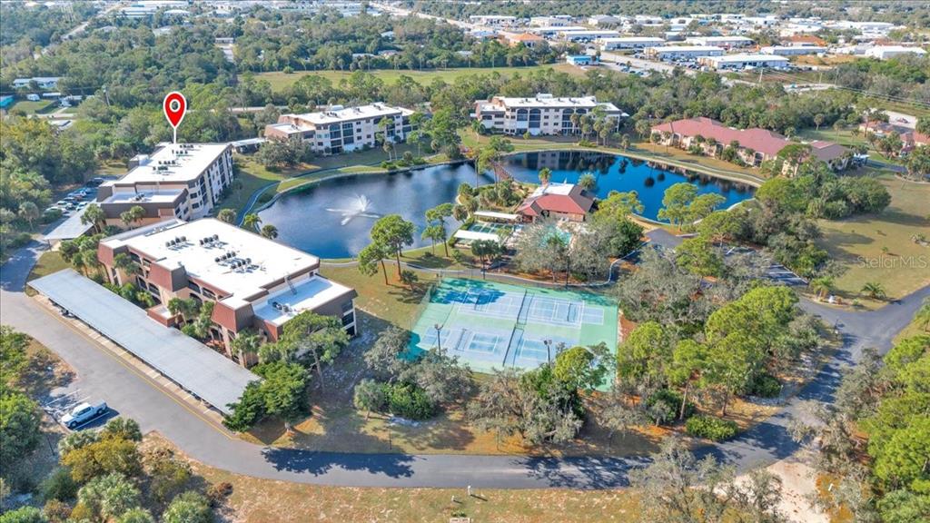 23465 Harbor View Road, Unit 723 Port Charlotte, FL 33980 - Photo 32 of 42 an aerial view of a houses with outdoor space