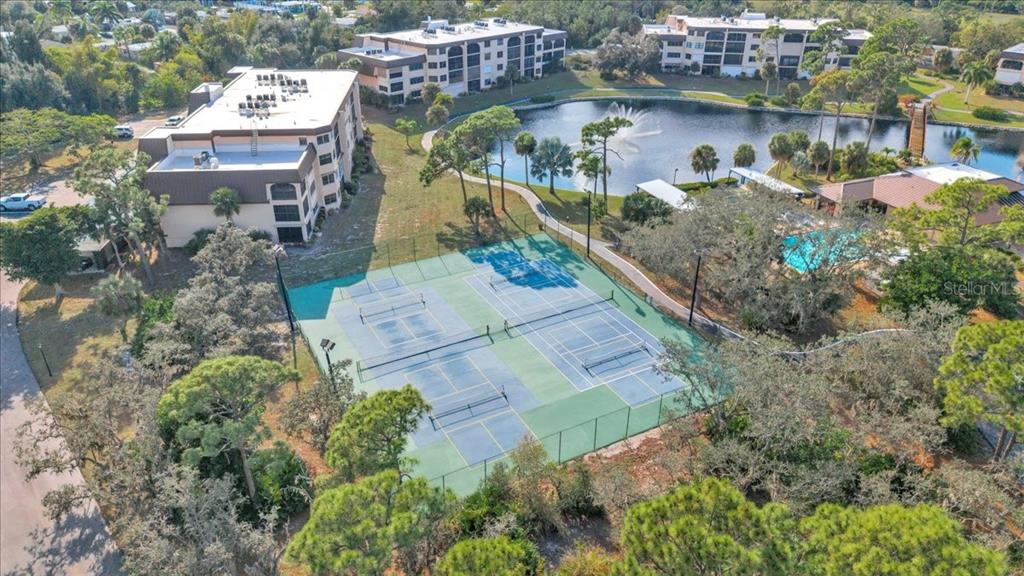 23465 Harbor View Road, Unit 723 Port Charlotte, FL 33980 - Photo 40 of 42 an aerial view of a house with outdoor space and lake view