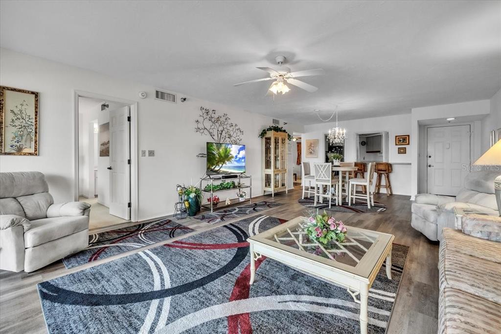 23465 Harbor View Road, Unit 723 Port Charlotte, FL 33980 - Photo 8 of 42 a living room with furniture and a table