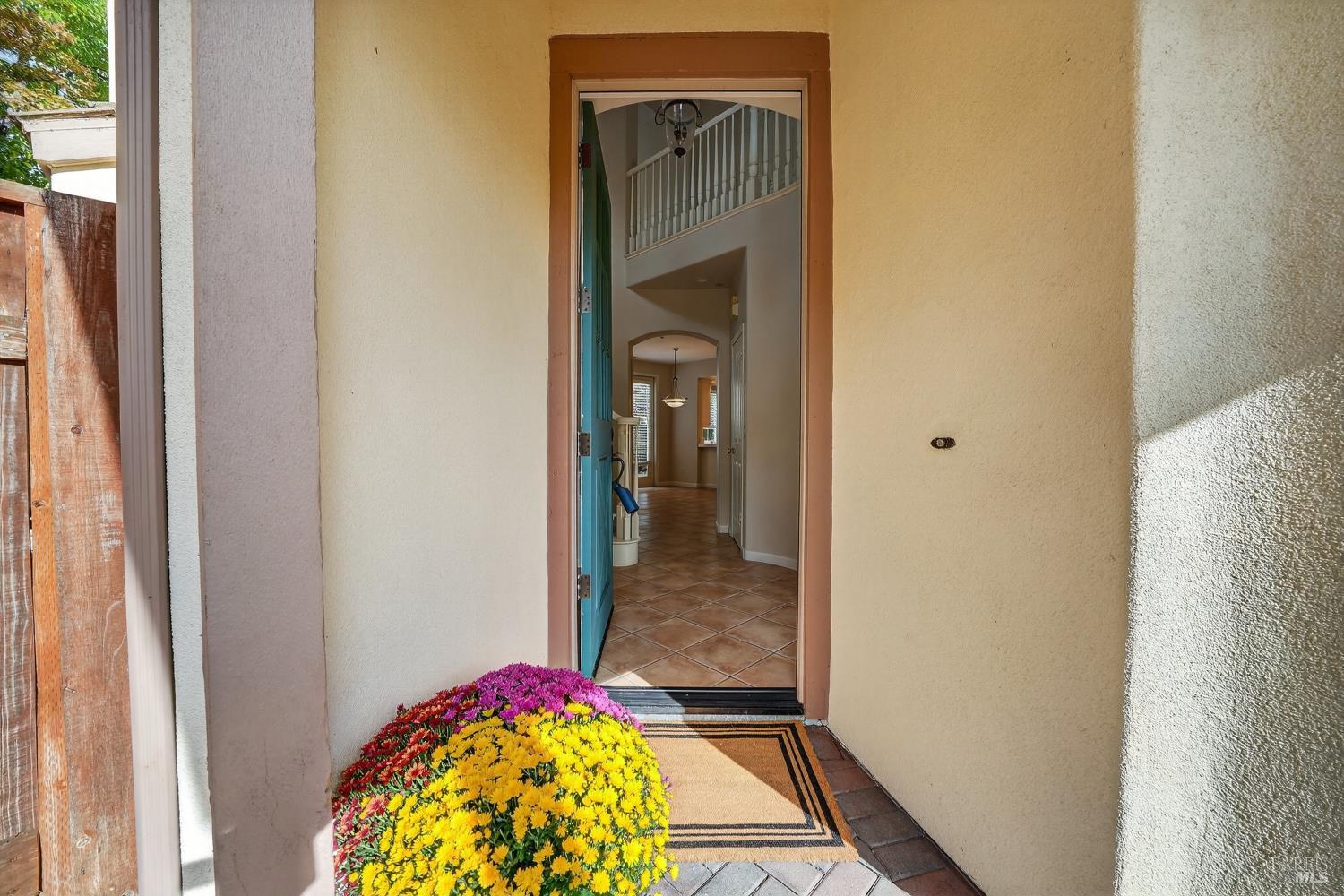 23 Greenham Court Novato, CA 94949 - Photo 2 of 20 a view of a hallway view with wooden floor and a dining room