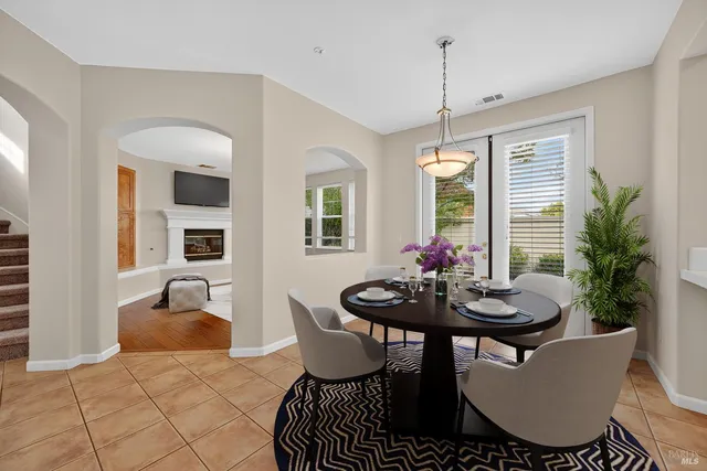 a dining room with furniture and window