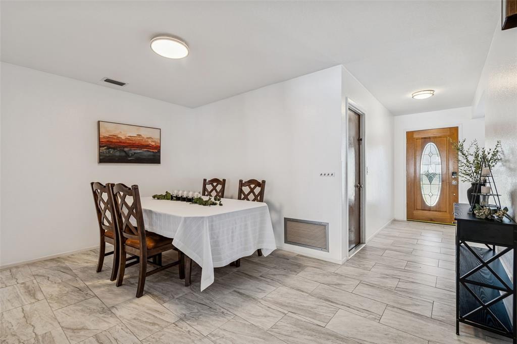 14301 86th Avenue North Seminole, FL 33776 - Photo 23 of 59 a view of a dining room with furniture