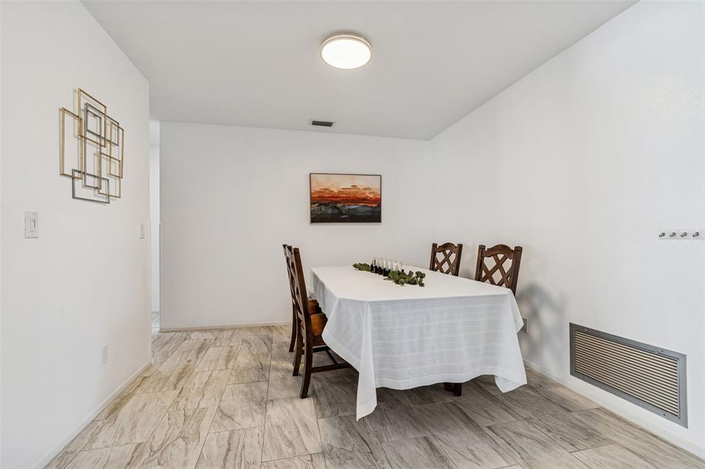 14301 86th Avenue North Seminole, FL 33776 - Photo 24 of 59 a bed room with a bed and a desk