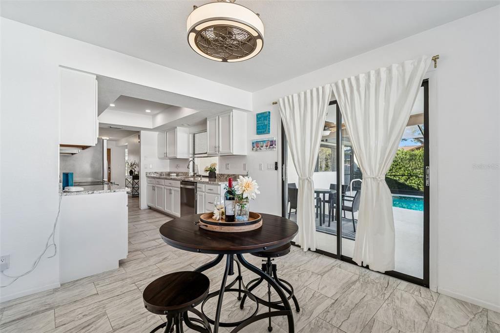 14301 86th Avenue North Seminole, FL 33776 - Photo 34 of 59 a view of a dining room with furniture and a rug