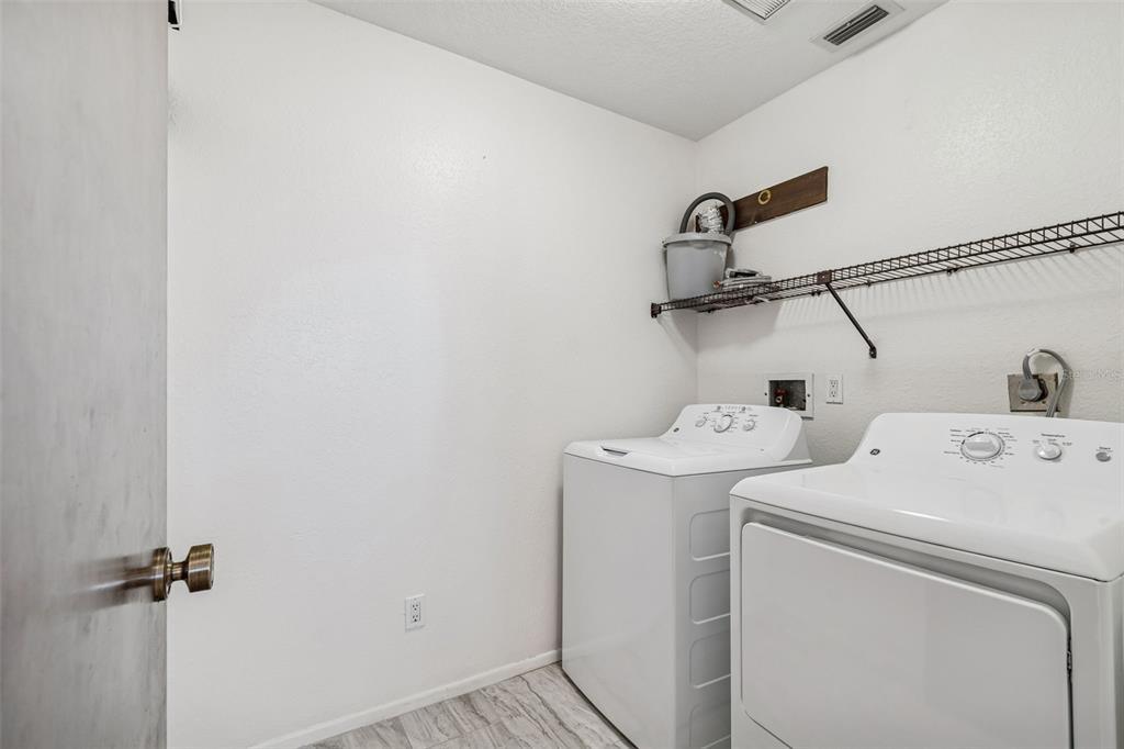 14301 86th Avenue North Seminole, FL 33776 - Photo 36 of 59 a utility room with dryer and washer
