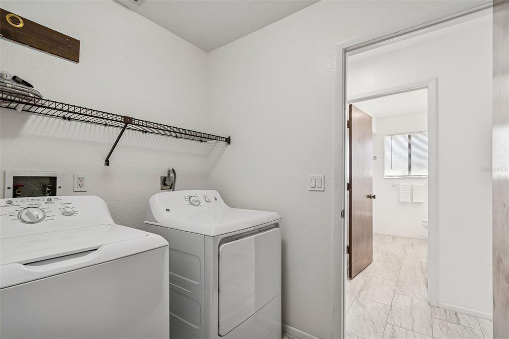 14301 86th Avenue North Seminole, FL 33776 - Photo 37 of 59 a utility room with dryer and washer