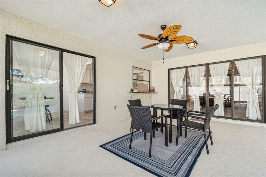 14301 86th Avenue North Seminole, FL 33776 - Photo 56 of 59 a view of a dining room with furniture window and outside view