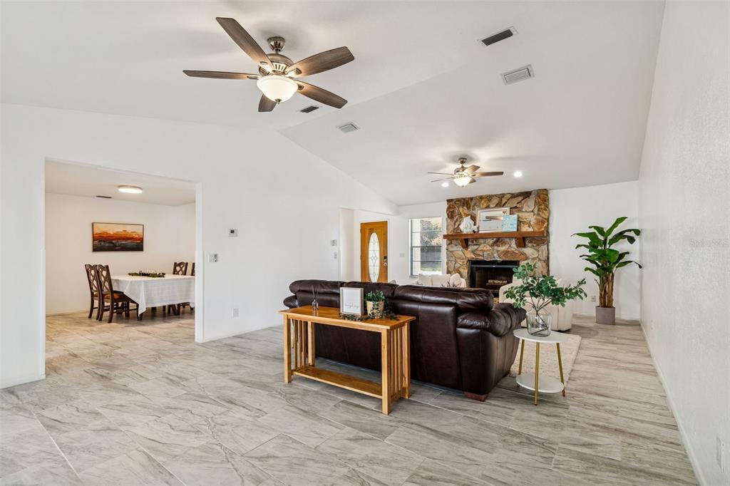 14301 86th Avenue North Seminole, FL 33776 - Photo 7 of 59 a kitchen with stainless steel appliances kitchen island granite countertop a stove and a sink