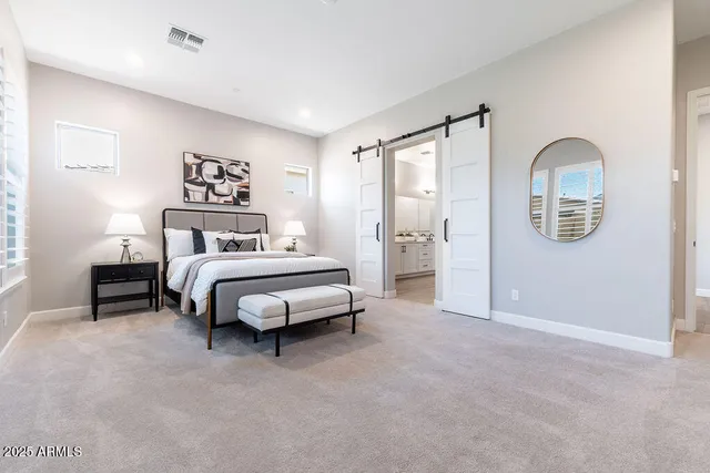 a view of a hallway with wooden floor and cabinet