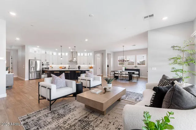 a living room with furniture and a table